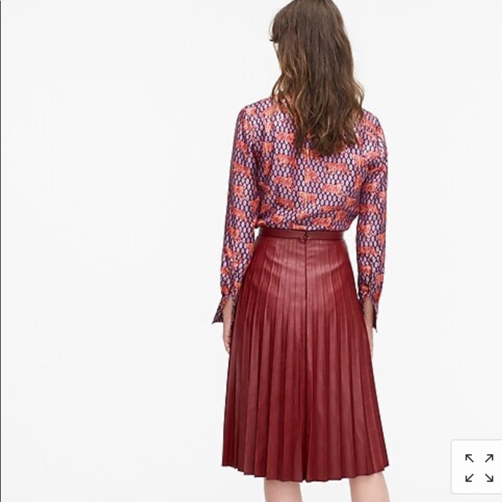 Faux leather pleated midi skirt.